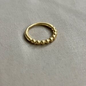 Golden ring with internal CZ stone